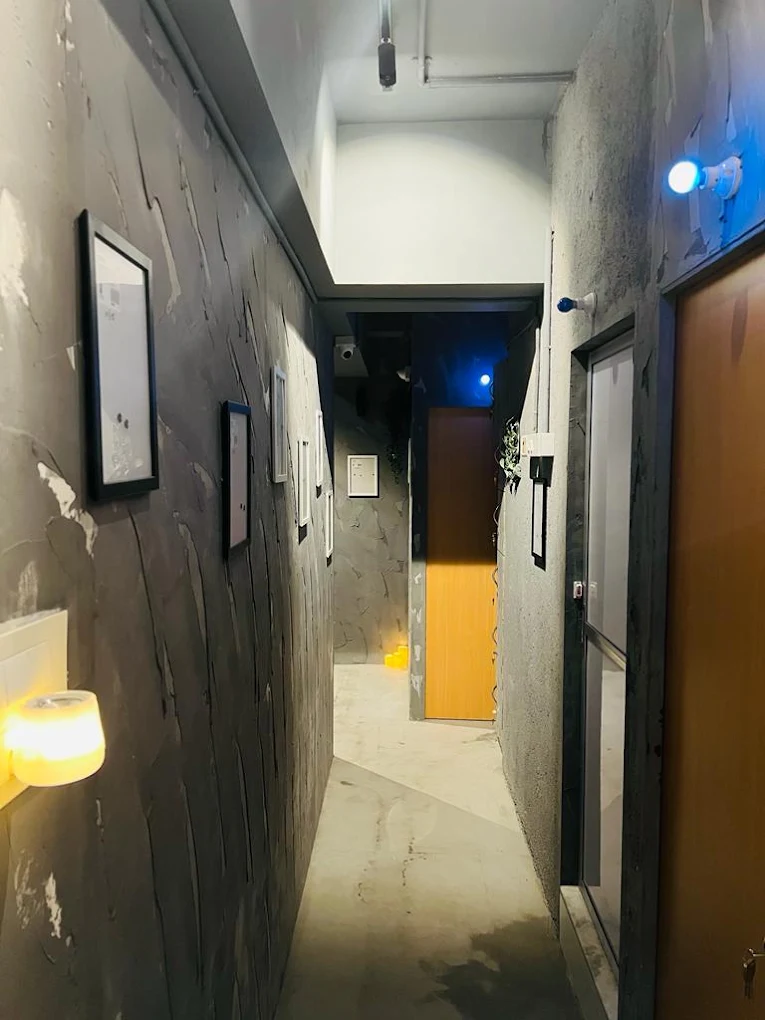 MIZMAR corridor with framed artwork and warm lighting
