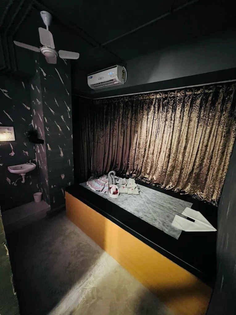 MIZMAR dark treatment room prepared for massage